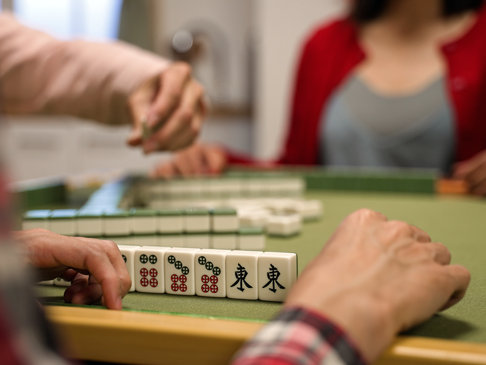 people playing Mahjong