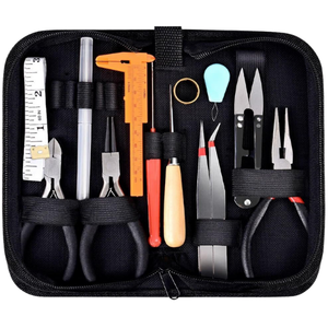 Kit with scissors, pliers, tape measure, and screw drivers