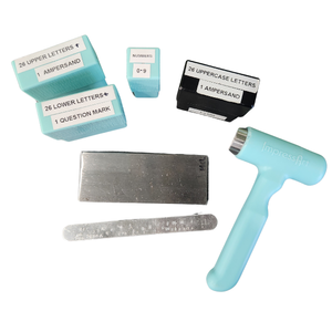 metal stamping kit with stamps, a file, and mallet