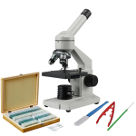 microscope with a box of slides and tweezers