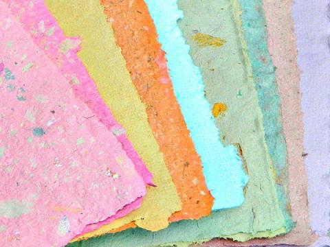 picture of handmade paper pink, yellow, orange, blue, greens, purple