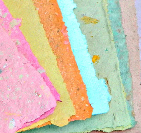 pink, yellow, orange, blue, green, teal, mauve pieces of handmade paper