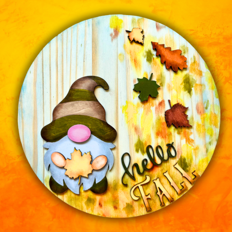 round wood with cutout wood gnome, hello fall, and leaves, painted in fall theme colors