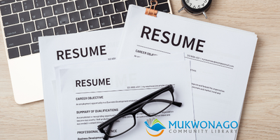 Photo of resumes and a pair of reading glasses with Mukwonago Community Library watermark. 