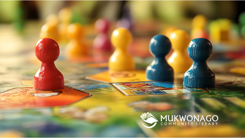 Photo of board game pieces with Mukwonago Community Library watermark. 