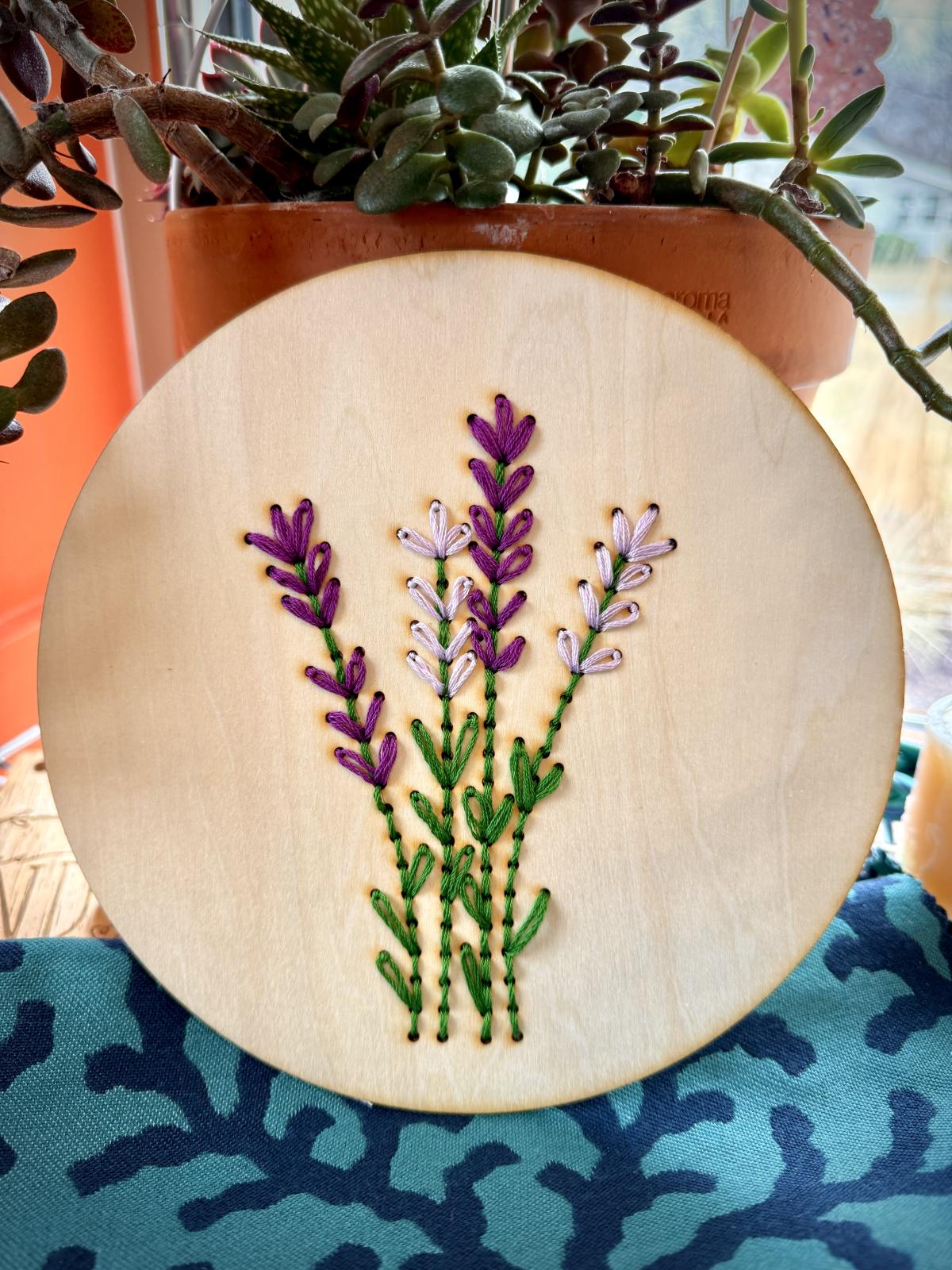 round wood circle with lavender flowers embroidered