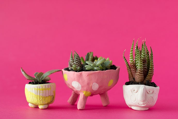 mini yellow, pink with polka dots, and white polymer clay pots