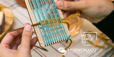 PHOTO hands holding small loom with blue warp and yellow weft